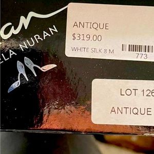 Off-white/ivory, satin wedding shoes.